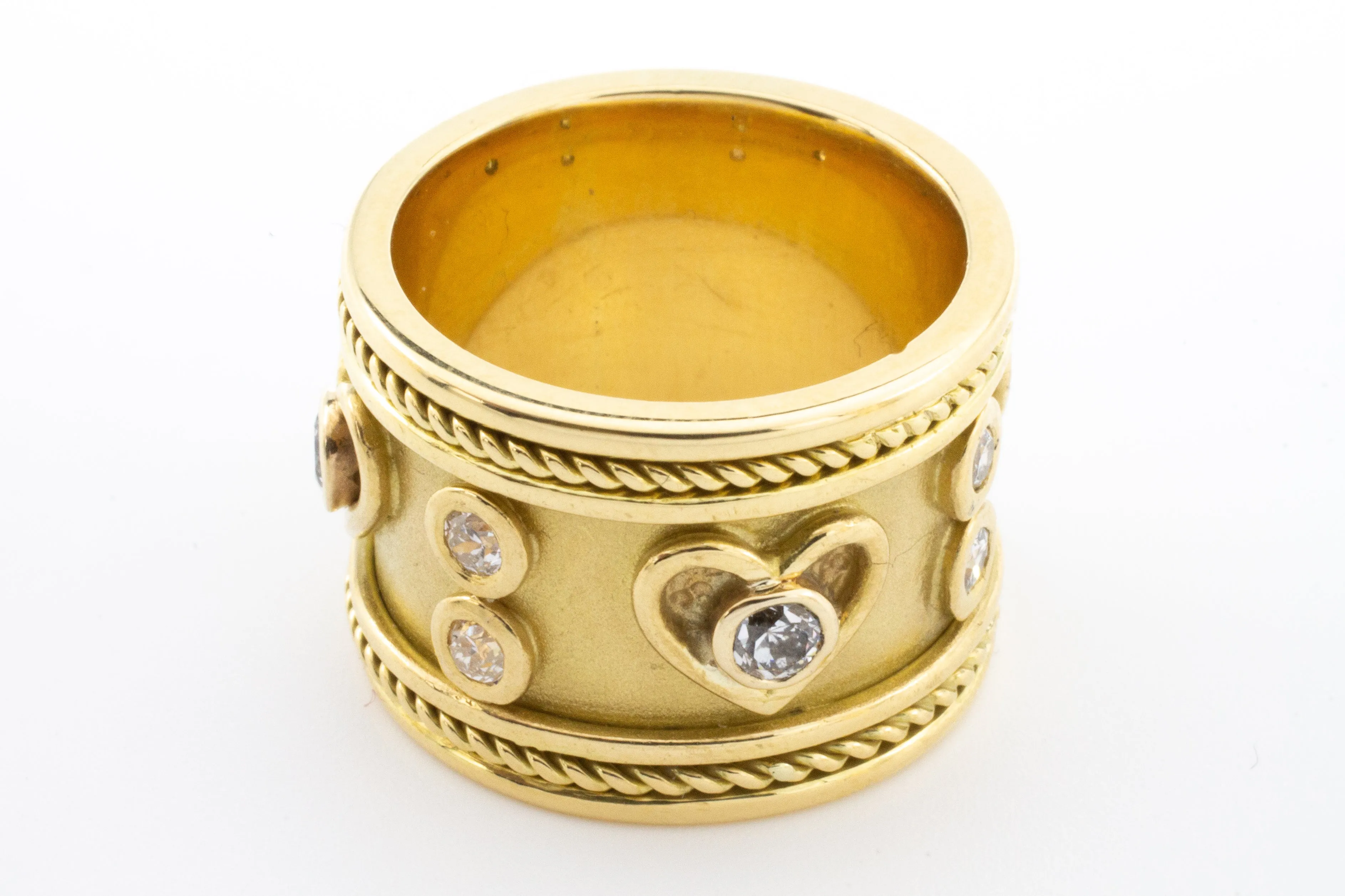 An 18 carat gold Elizabeth Gage style ring with diamonds