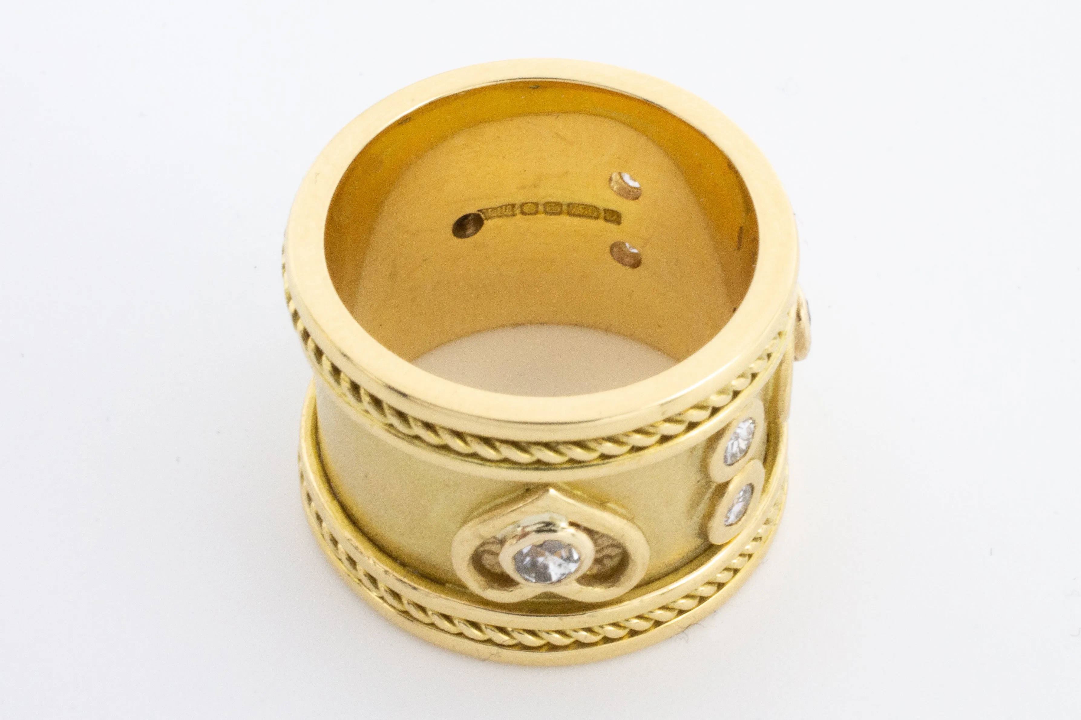 An 18 carat gold Elizabeth Gage style ring with diamonds